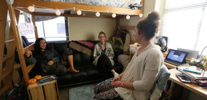 Students chatting in an apartment