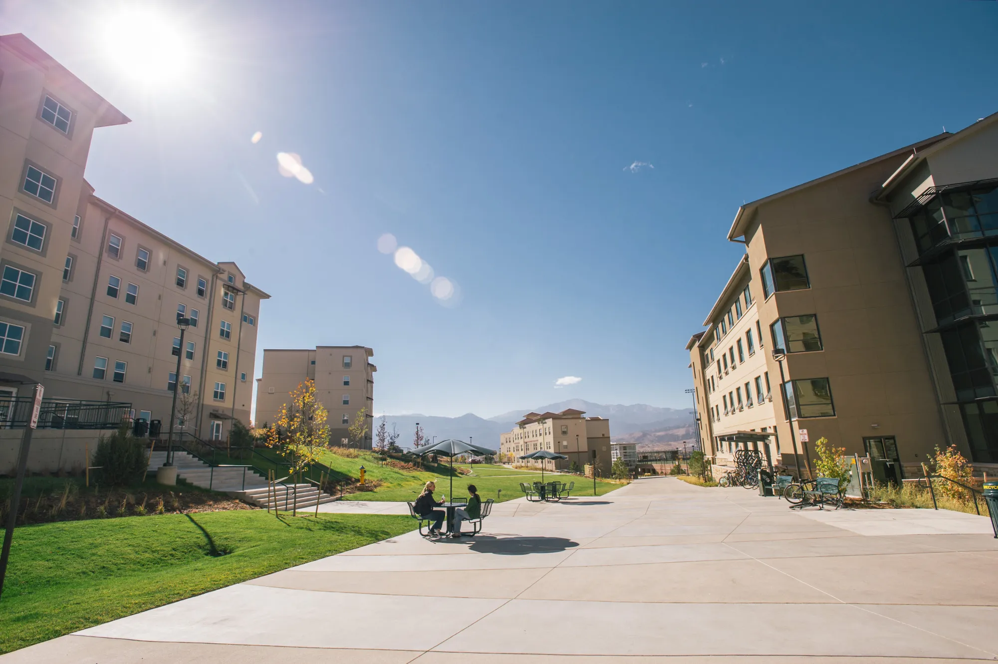 Two students sitting in Alpine Village.