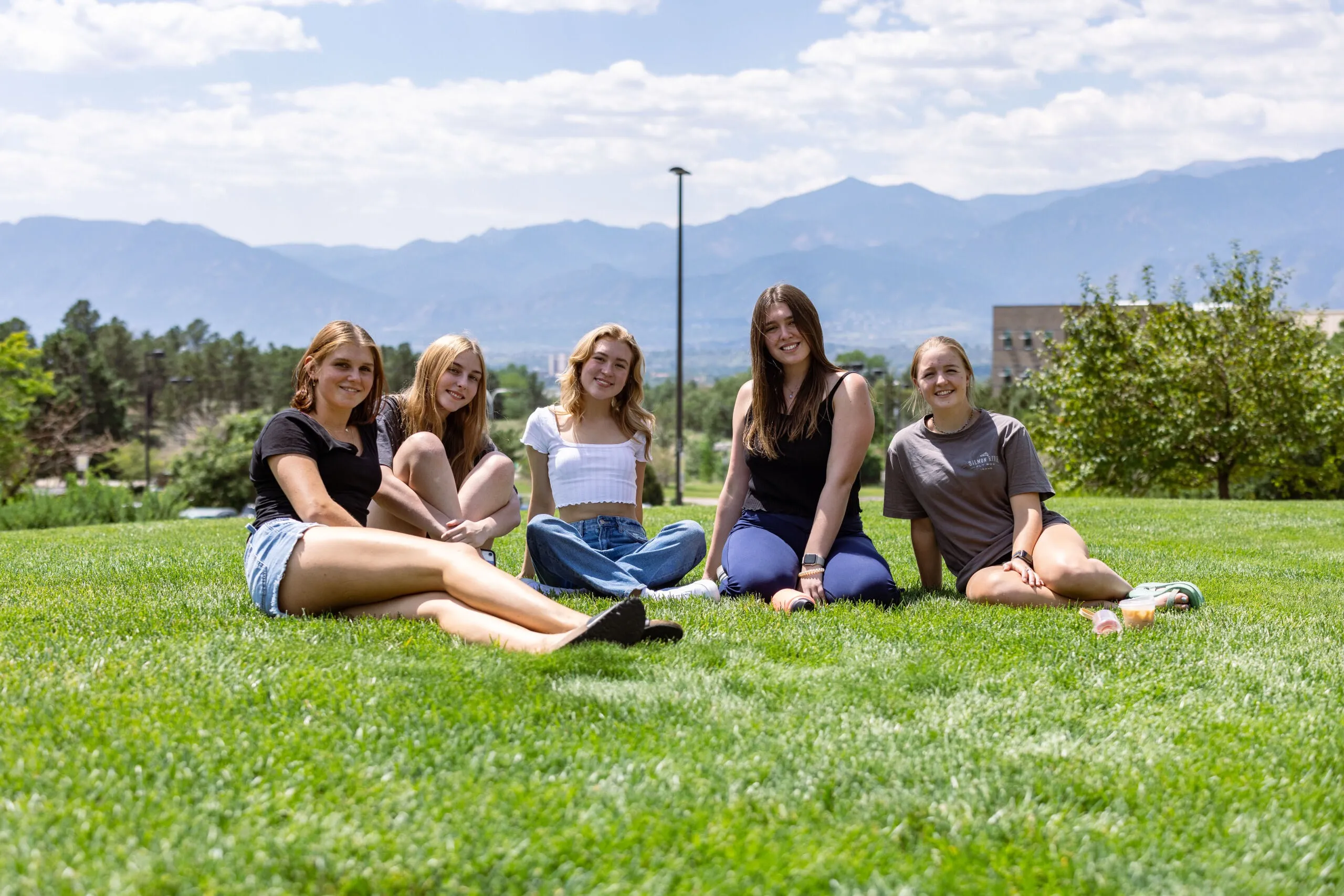 Students relaxing on the lawn