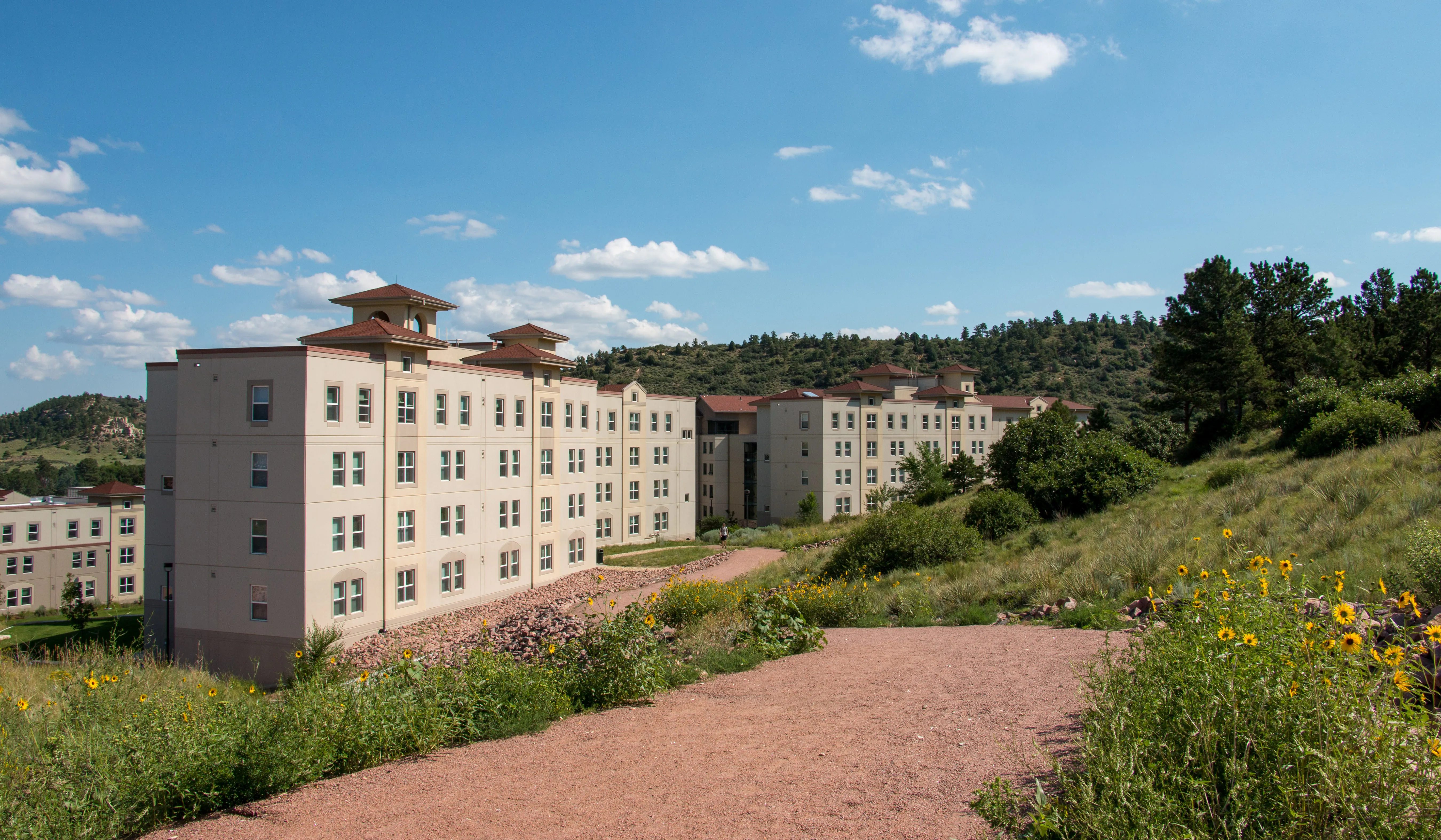 exterior of residence halls next to hiking trails