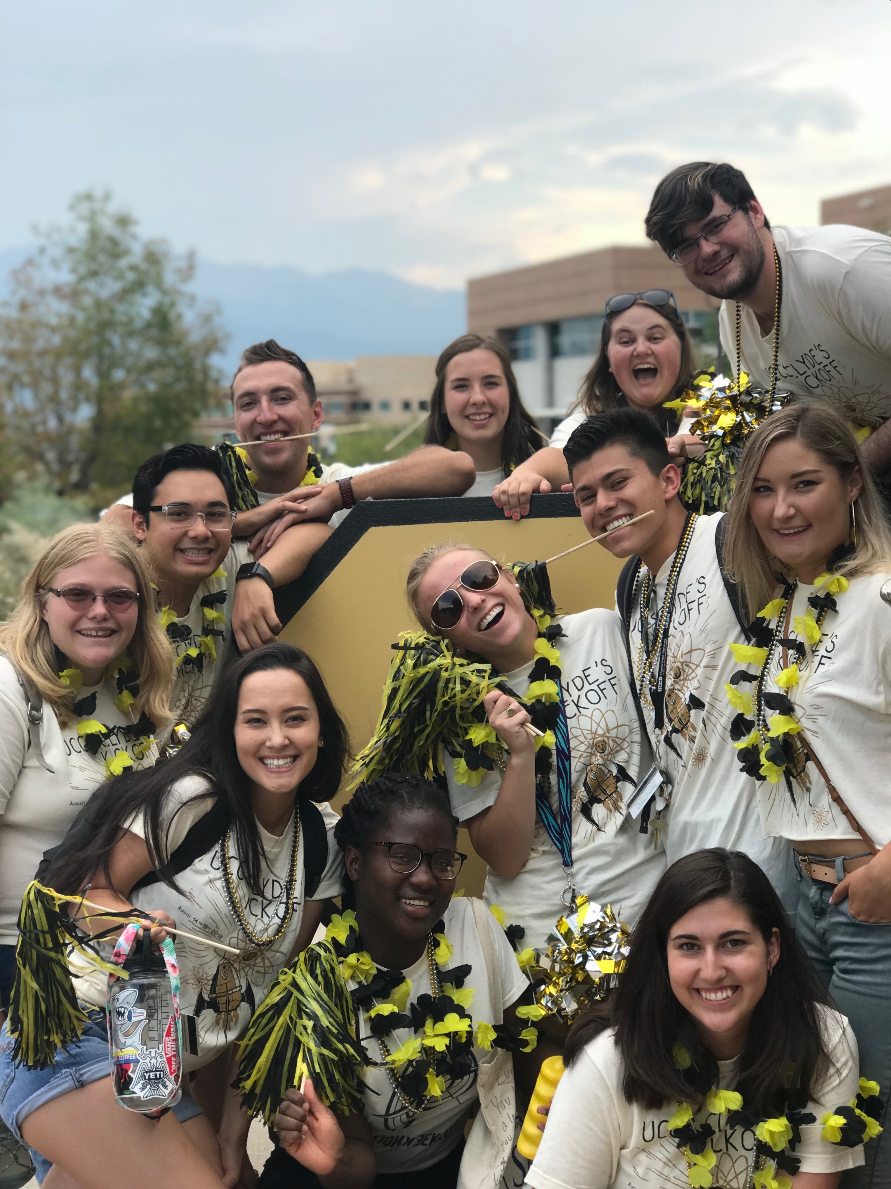 A Group of Resident Assistants Posing for a Playful Photo
